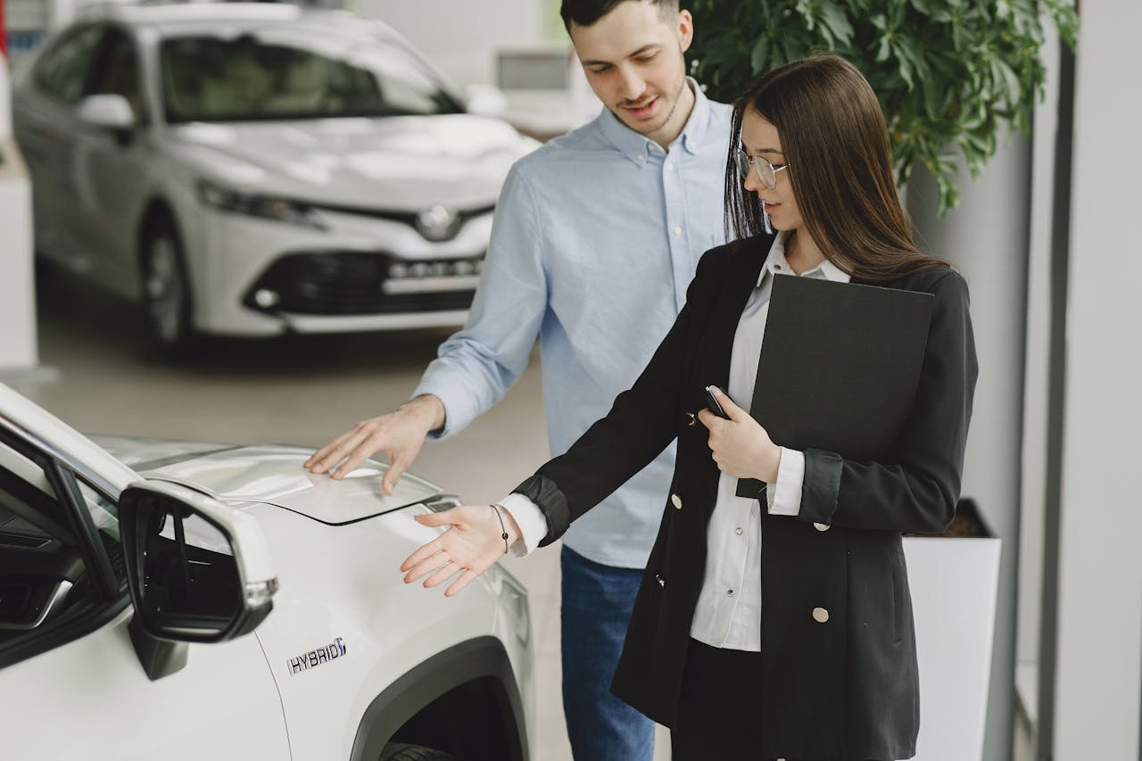Close-up of a couple holding keys, symbolizing homeownership and investment.